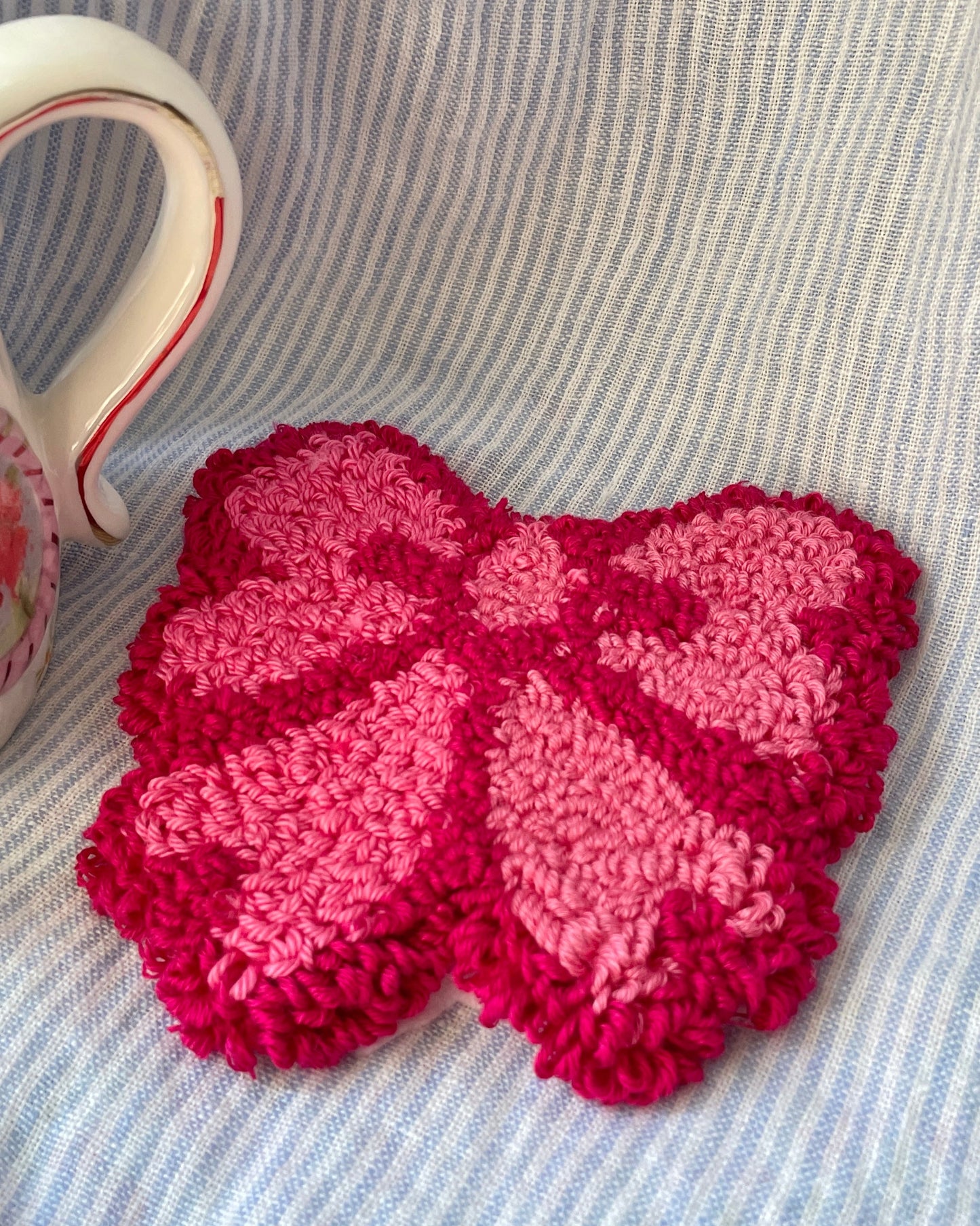 Dark pink bow mug coaster